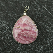 Argentine Rodocrosita Round Pendant in Silver Wire